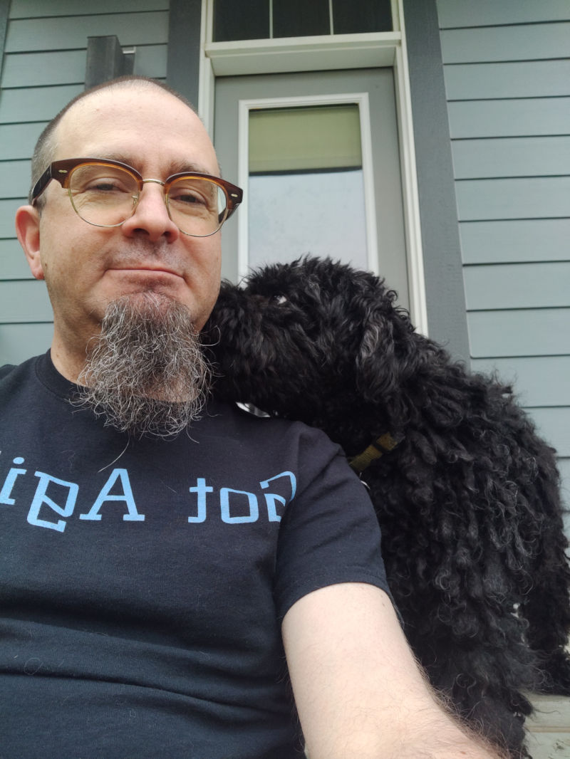 Zoe with her snout against Don's cheek